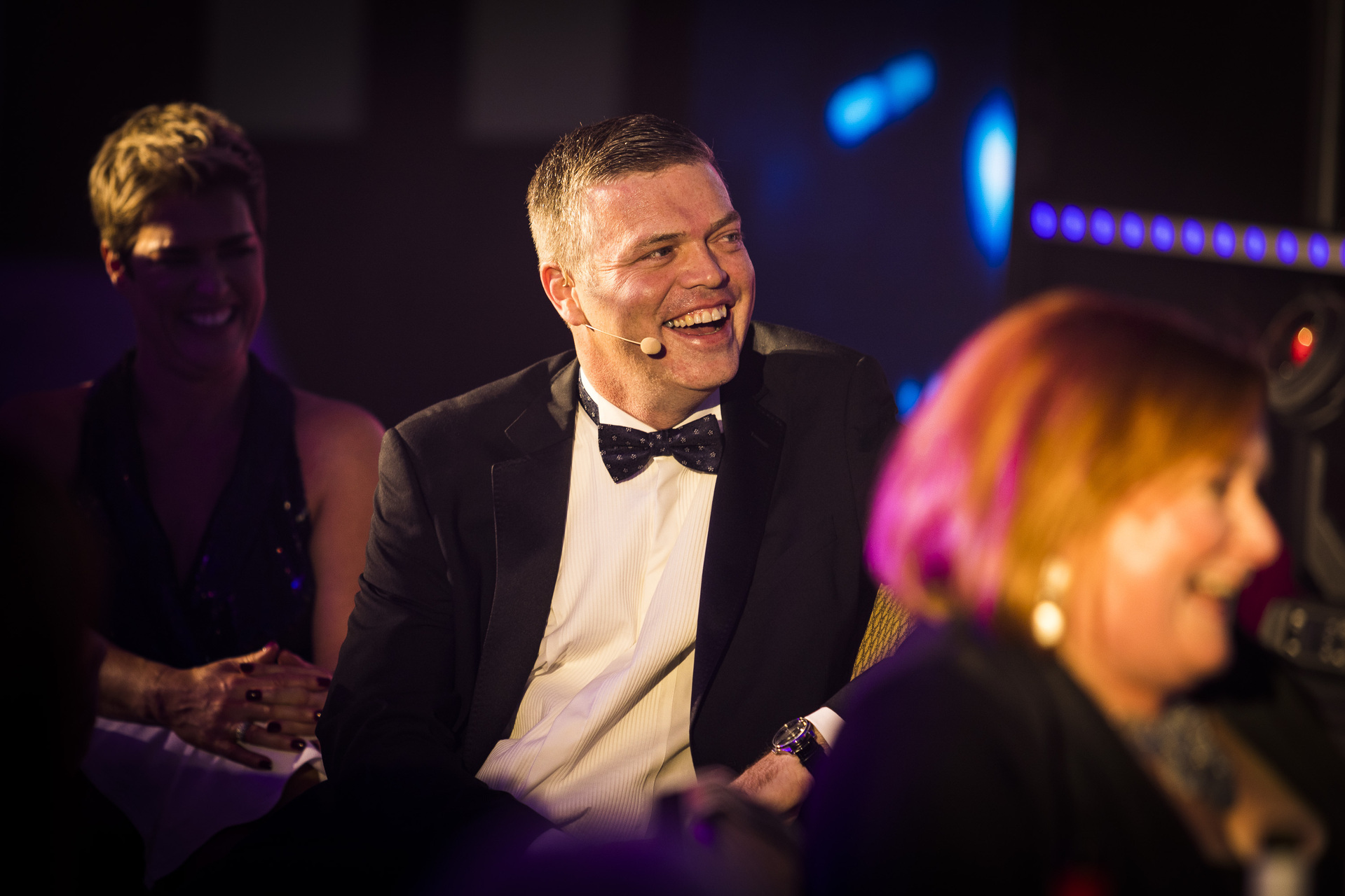 a man in a suit at the nhbc pij quality awards smiling