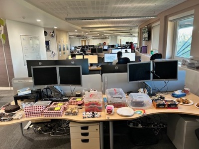 a photo of a cake sale in the nhbc's offices