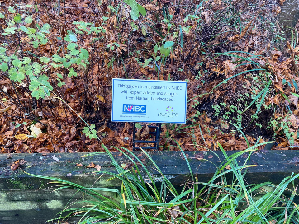 a sign showing the work nhbc staff members do to maintain gardens