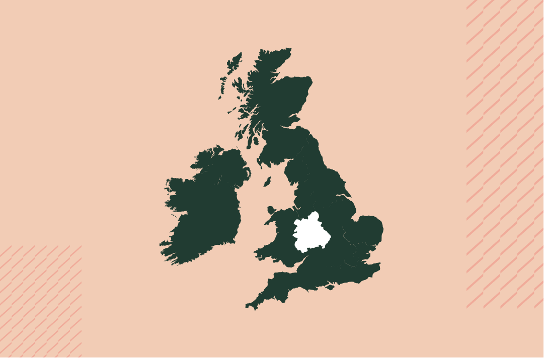 a map of the uk and ireland in navy on a salmon pink background with the west region in white