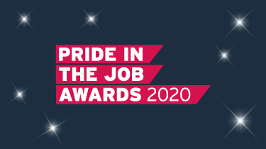 the Pride In The Job Awards logo, written in very bold white letters and a magenta block on a navy background with white stars