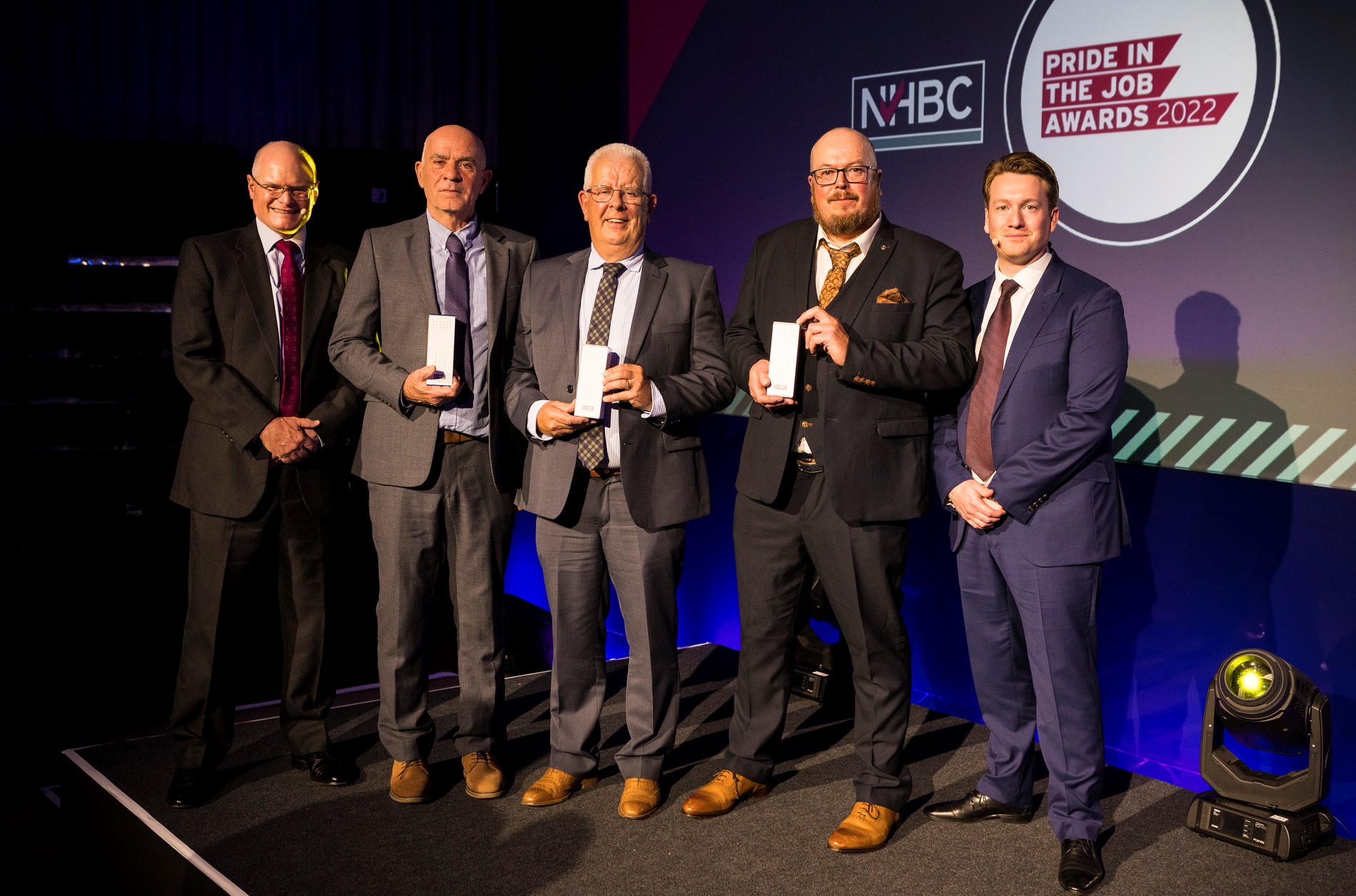 the east regional winners of nhbc's pride in the job award smiling at the camera