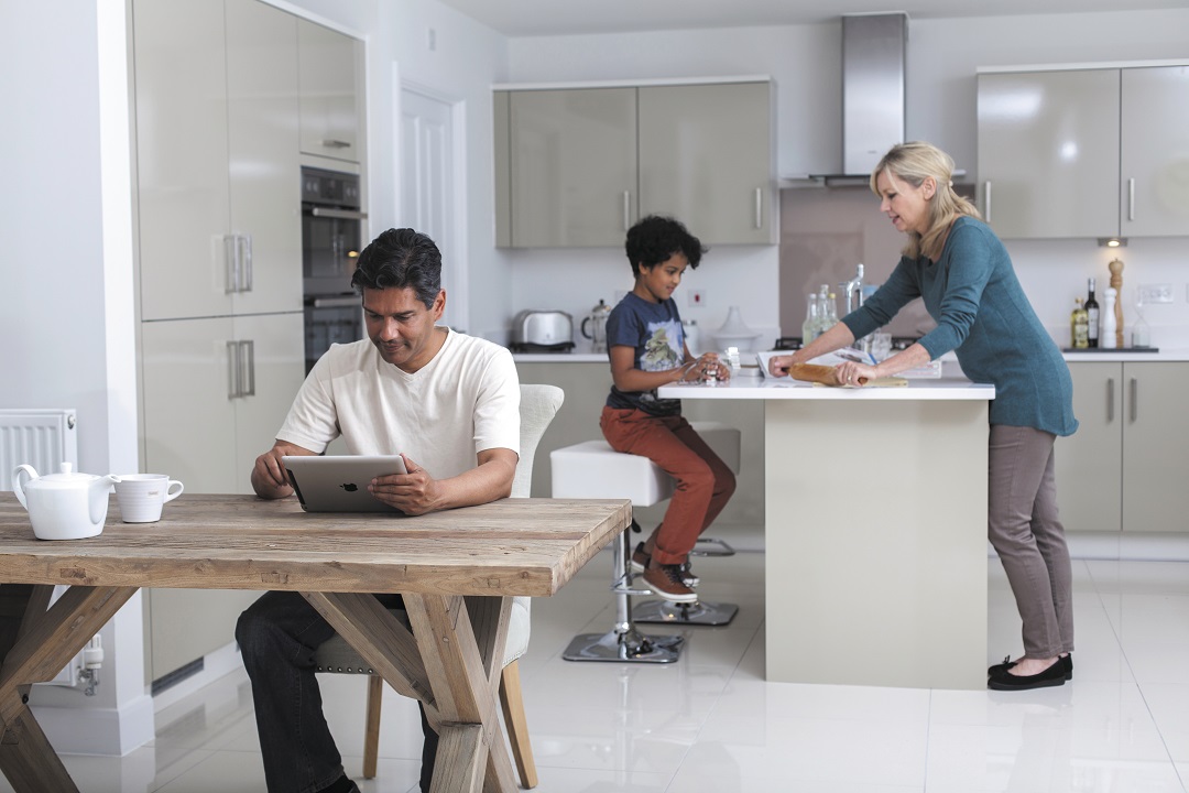 a family spending time together in a light, modern kitchen