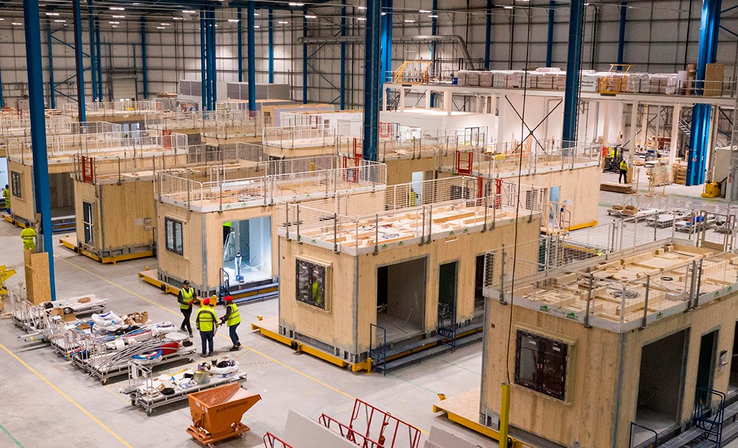 a photo of a warehouse containing training construction rooms