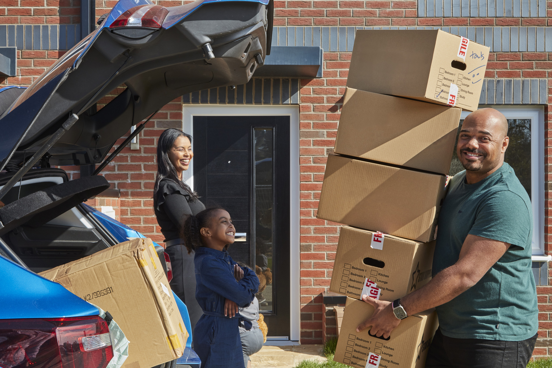a photo of a family moving in