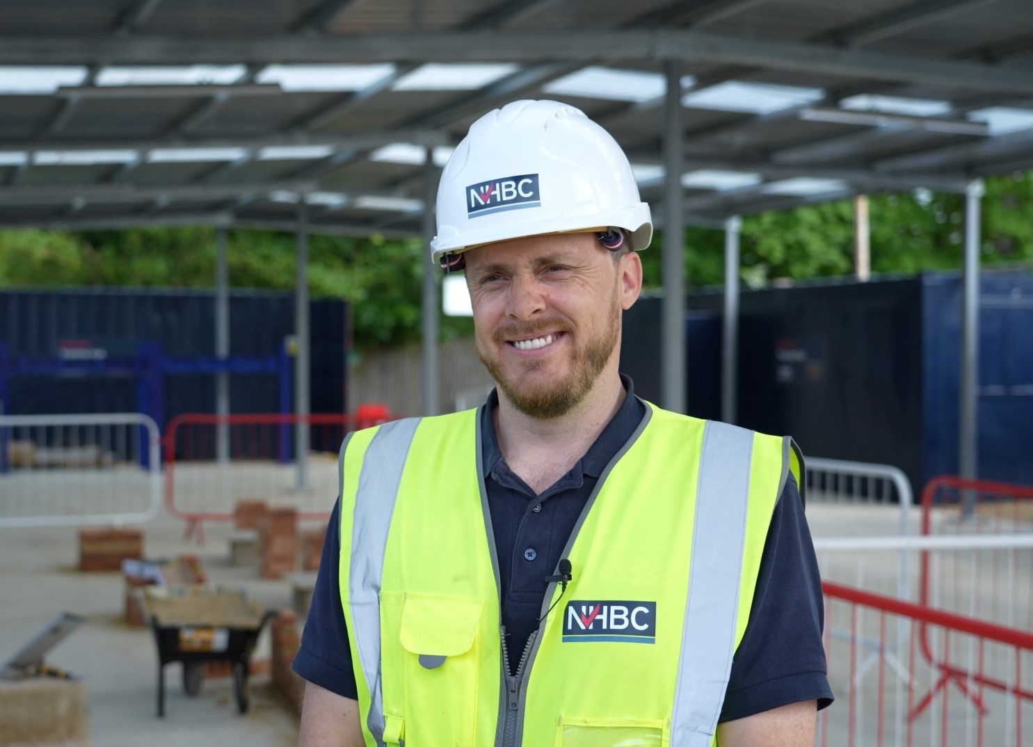 a photo of a man called matt smiling at the camera while wearing site safety clothing