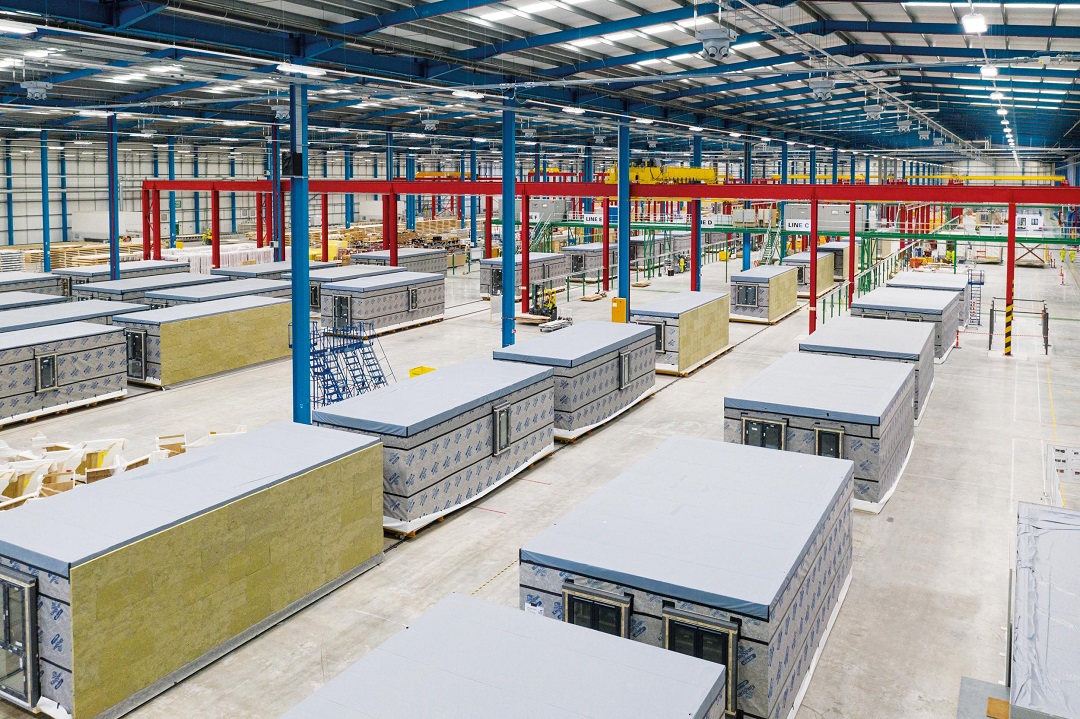 a warehouse full of prebuilt rooms covered in cladding