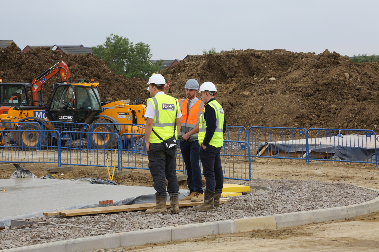 a photo of two people wearing site safety clothing on site