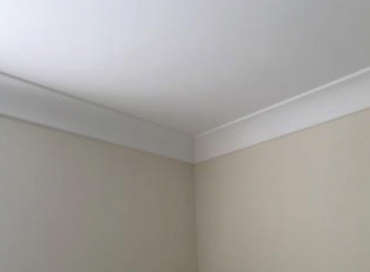 a photo of a corner of a ceiling