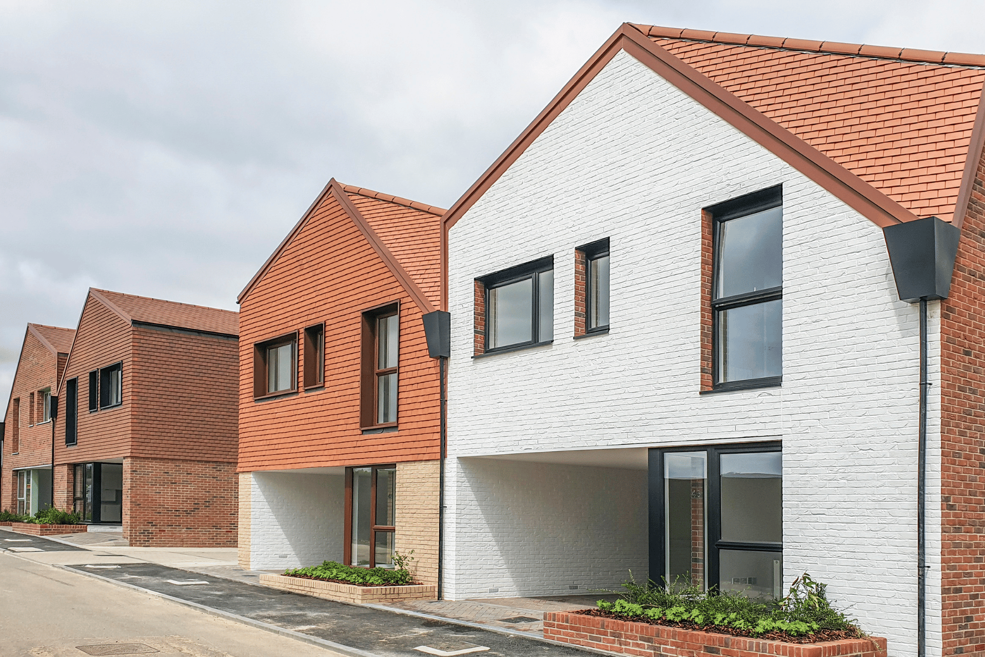 a photo of two new build houses