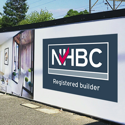 a board with the nhbc logo in white, blue and pink