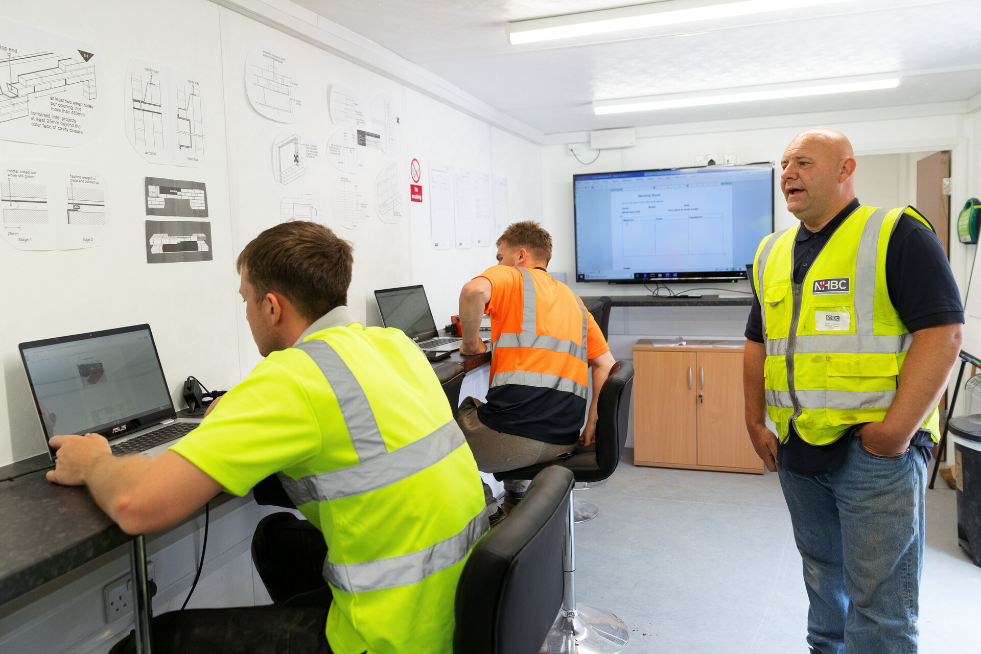 a photo of some apprentices studying at an nhbc training hub