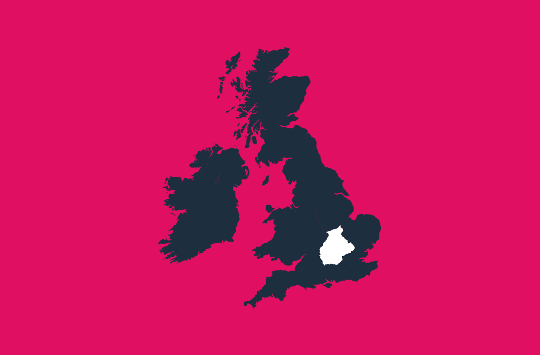 a map of the uk and ireland in navy on a pink background with the central region in white